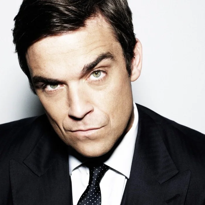 ROBBIE WILLIAMS : UNE LÉGENDE DE LA MUSIQUE POP